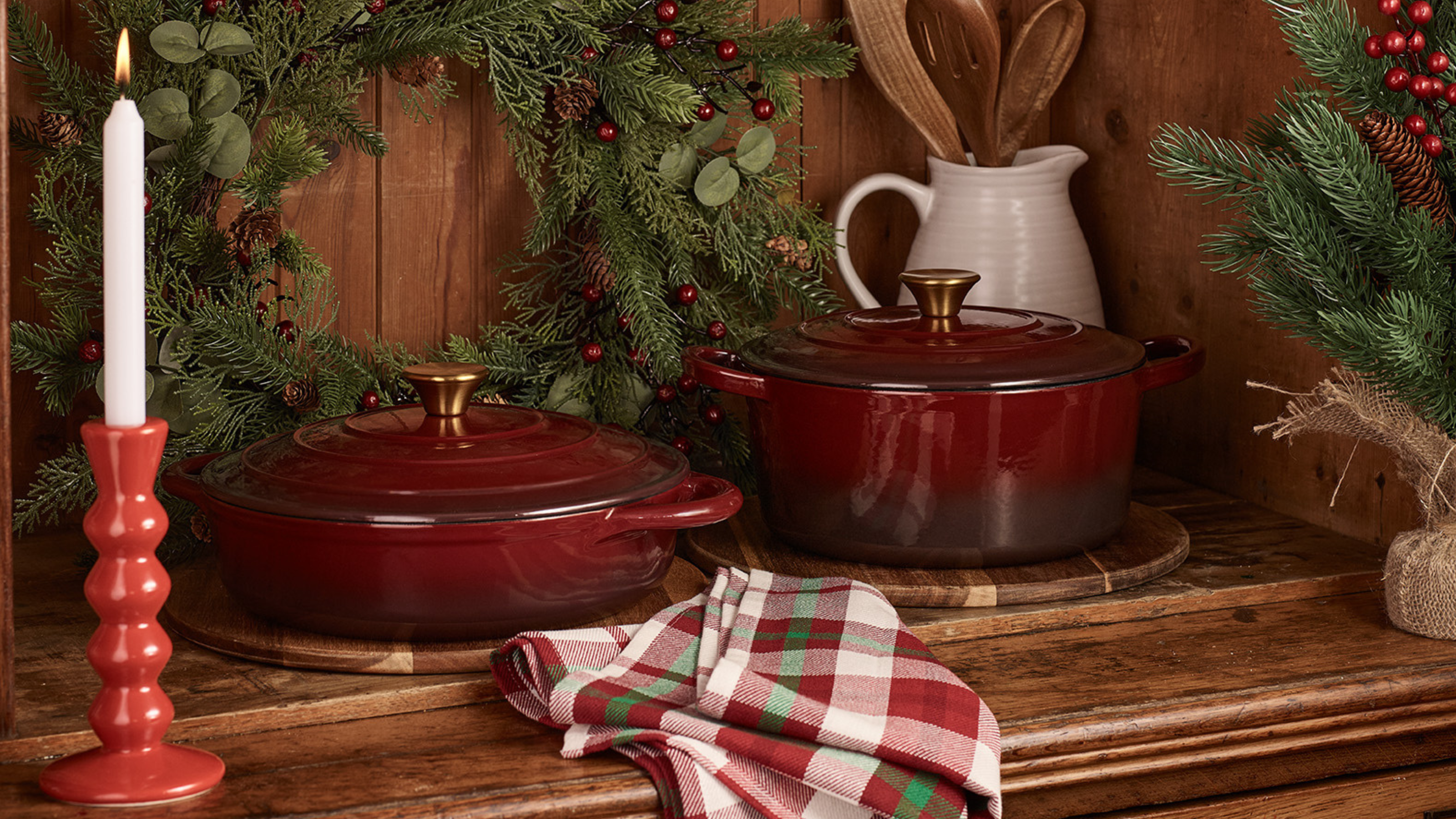 George Home Cast Iron Collection in burgundy on a festive dresser.