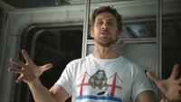 Ryan Gosling gesturing with his hands, his glasses hanging off his face in Project Hail Mary