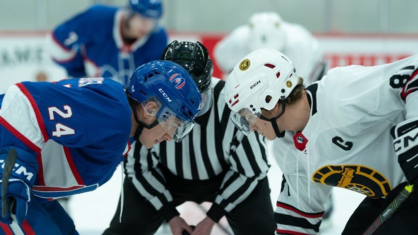From left to right: Shane and Ilya facing off against each other during a hockey game. 