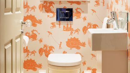 A cloakroom painted in coral pink