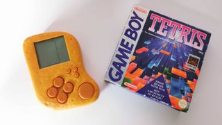 Mcnugget handheld next to copy of Tetris for Game Boy
