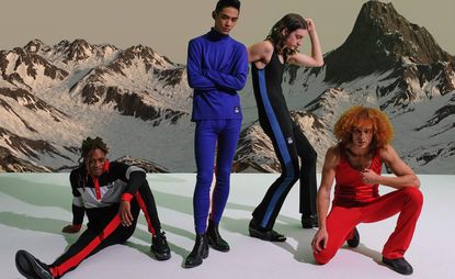 Male models posing in front of a snowy mountain