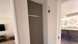 Panelled alcove with silver hooks