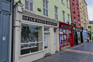 A traditional photography lab store front