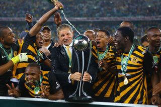 Kaizer Chiefs coach Stuart Baxter celebrates with his players after victory in the Nedbank Cup final in May 2013.