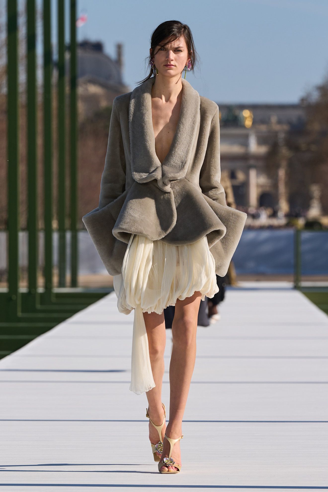a model walks the christian dior f/w 26 runway.