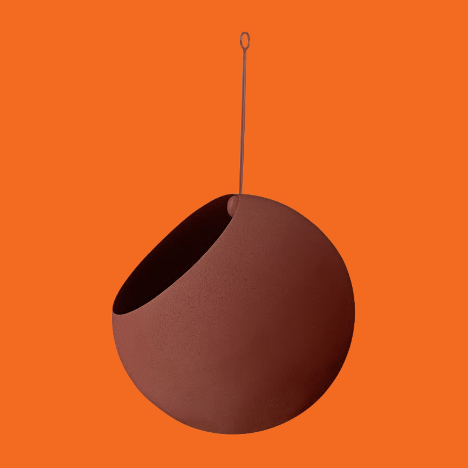 A rust orange hanging pot