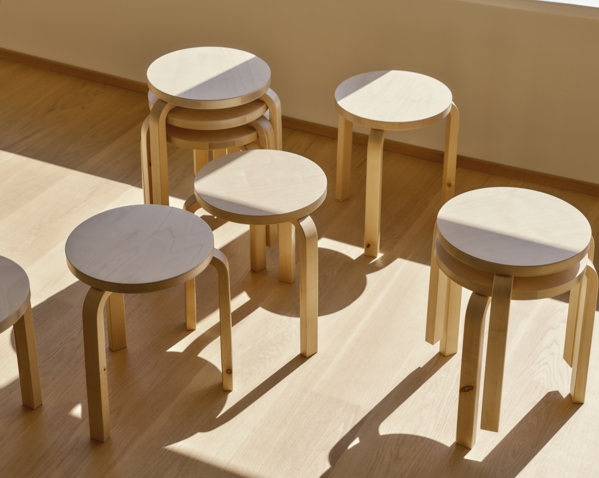 artek stools in a simple room