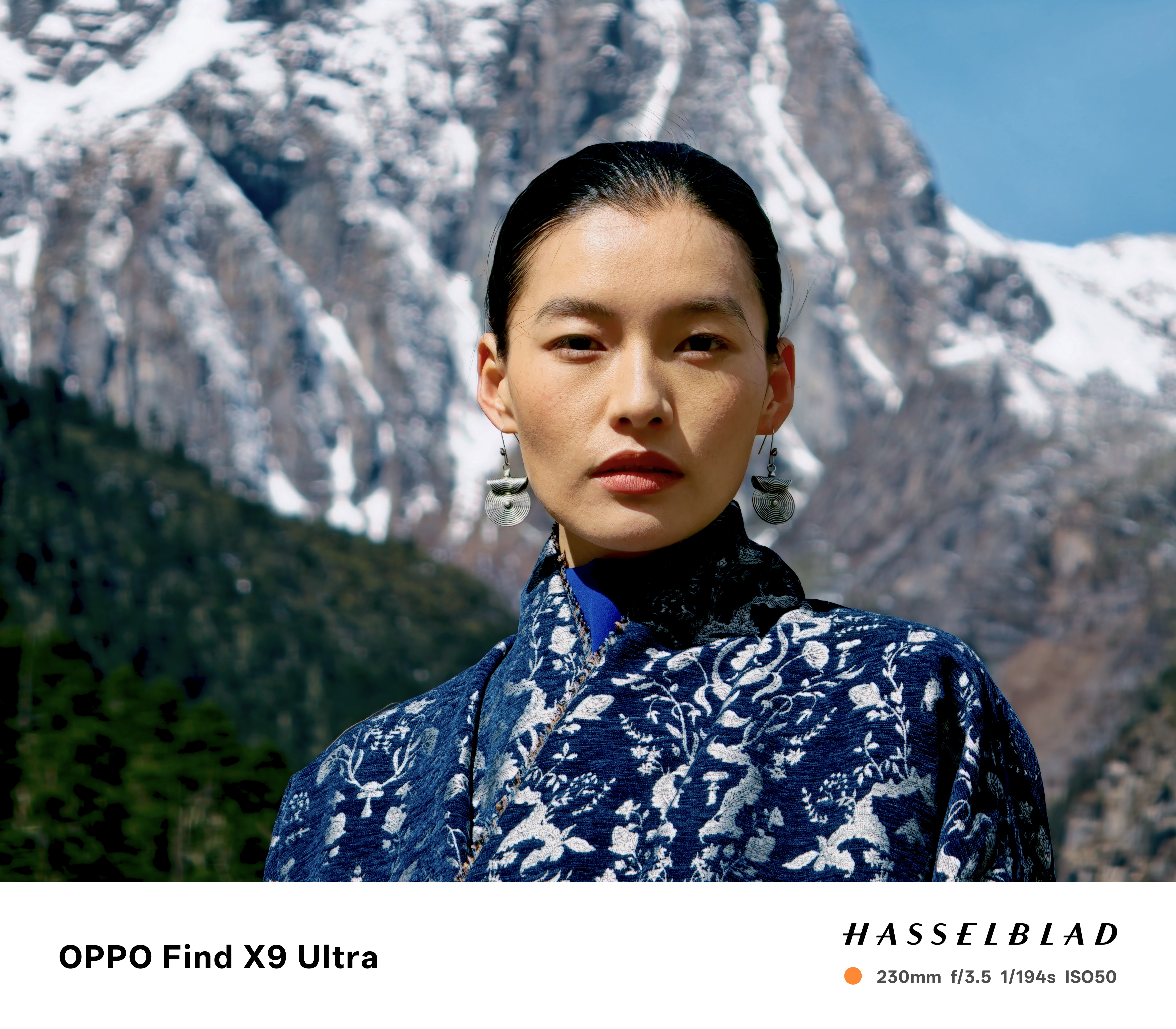 Portrait of Tibetan woman in front oa snowy mountain