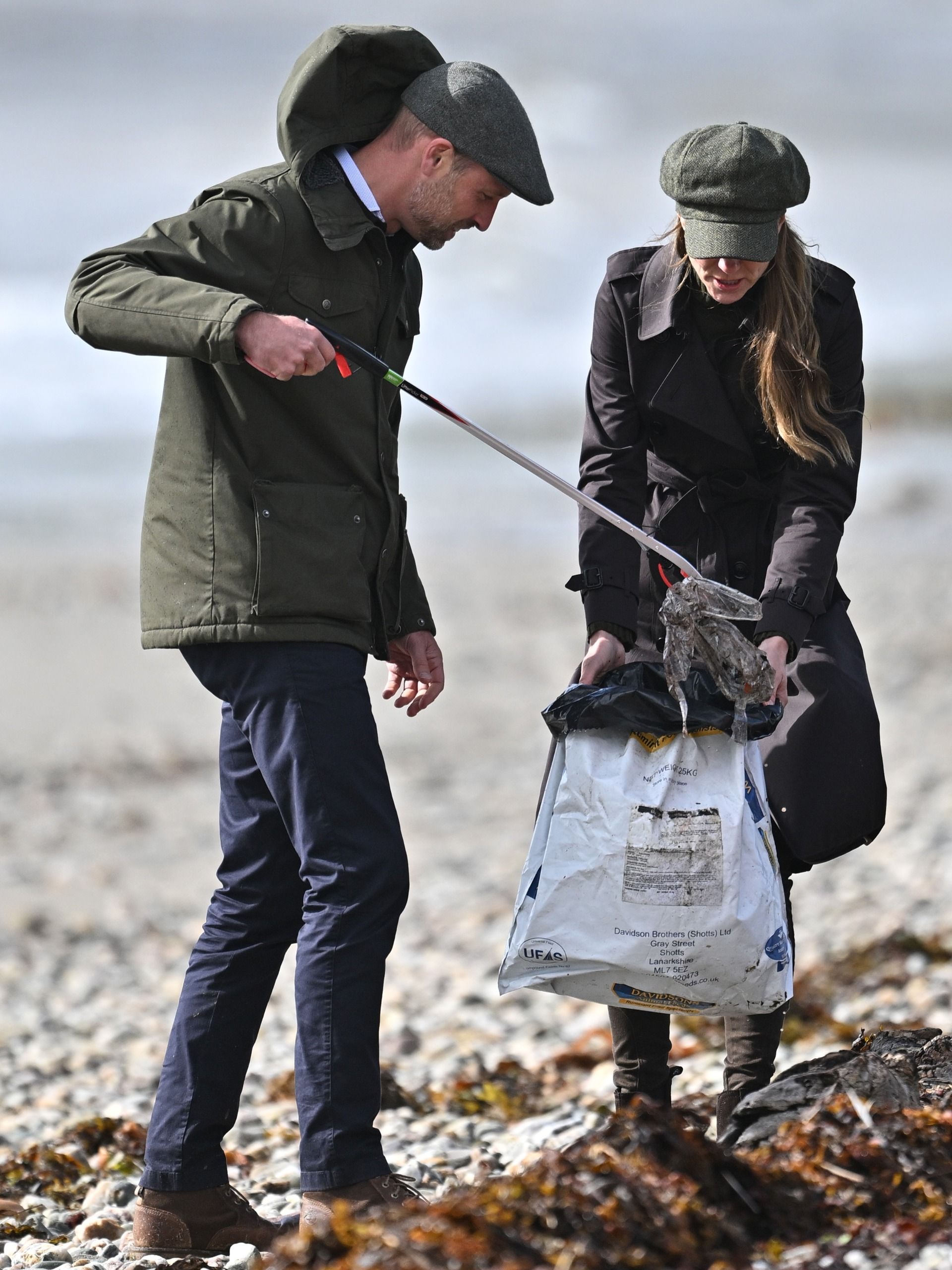 Prince William and Princess Kate picking up trash