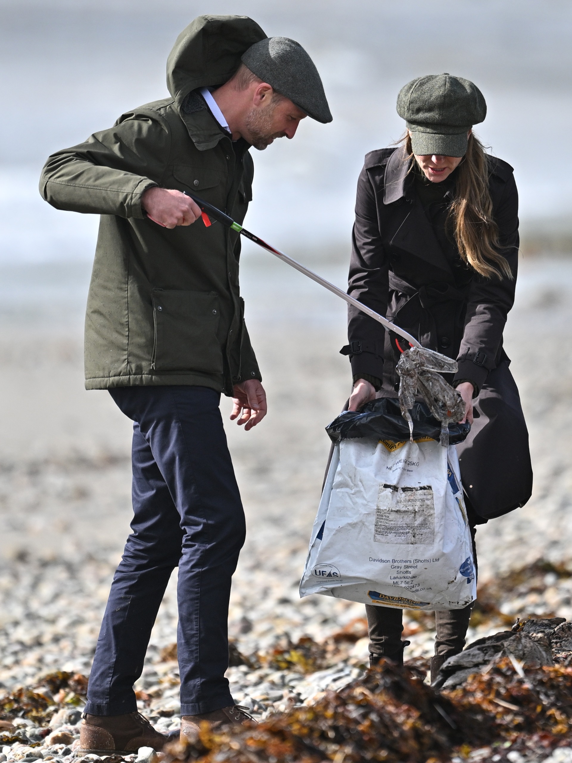 Prince William and Princess Kate picking up trash