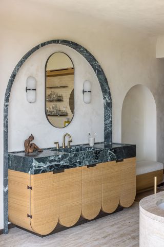 a bathroom vanity with a curved base