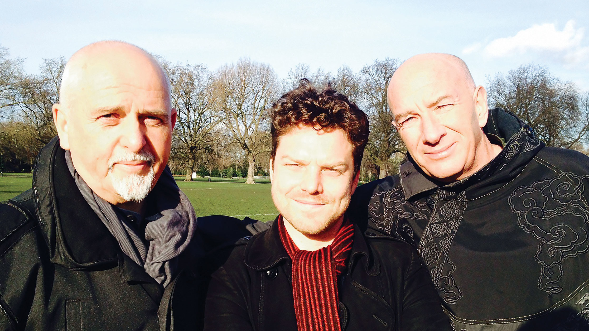 Peter Gabriel poses with Brian Pern actors and writers Rhys Thomas and Simon Day in a park