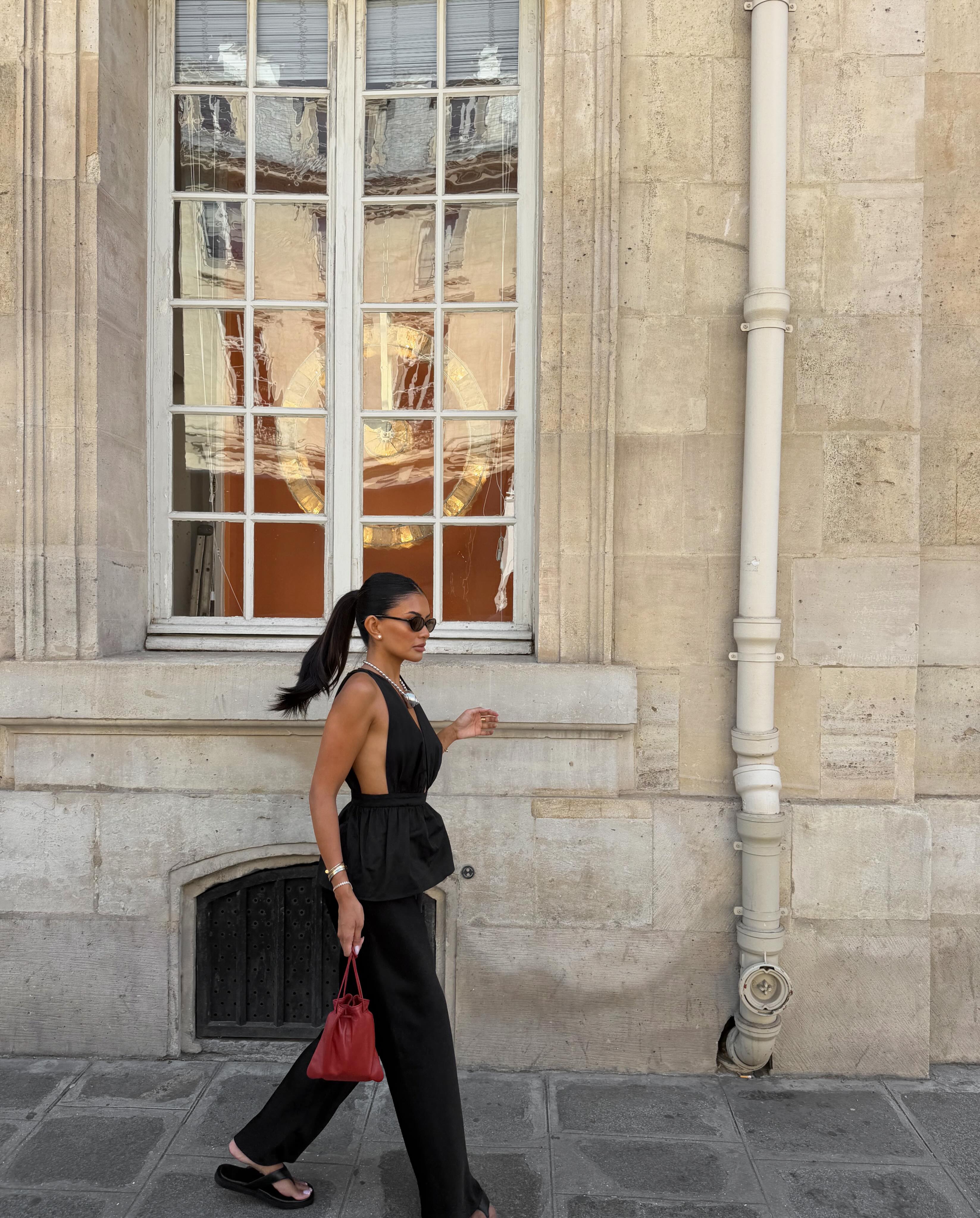 A woman wearing the thick-thong-sandal trend.