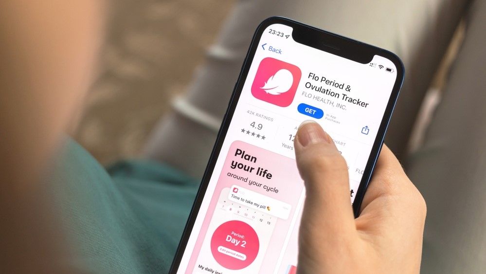 a photo of a woman using the Flo period tracking app