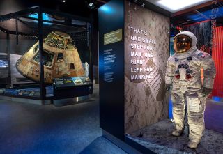 Neil Armstrong's Apollo 11 spacesuit and the mission's command module "Columbia" in the "Destination Moon" gallery at the National Air and Space Museum in Washington D.C.