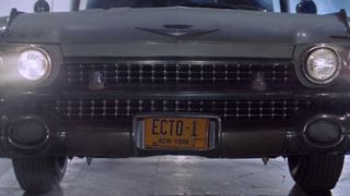 The Ecto-1 exits the Ghostbusters' firehouse garage for the first time