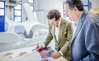 Land Rover design director Gerry McGovern, left, working on the designs with artist Nino Mustica