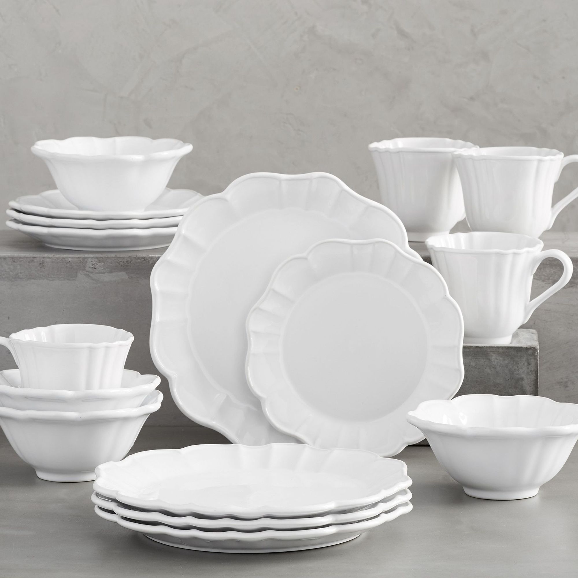 White dinnerware set with subtle scalloped edge