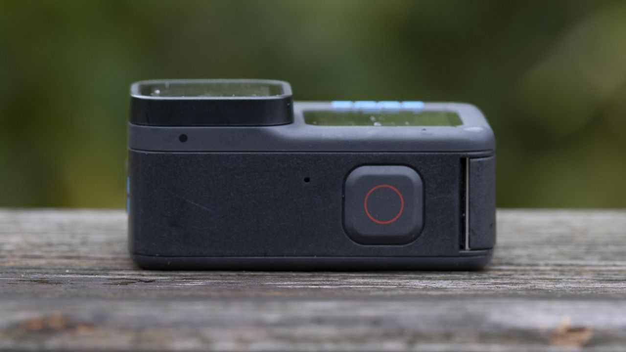 The GoPro Hero 11 Black action camera sitting on a wooden platform