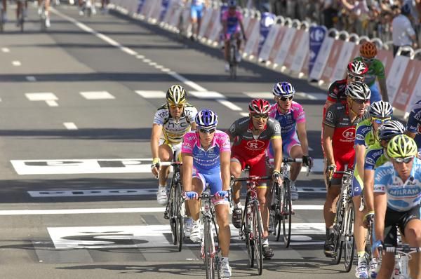 The group of Lance Armstrong comes across the line.