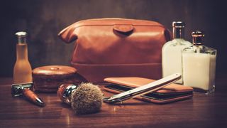 Men’s grooming kit, including wash bag, razor, lotion