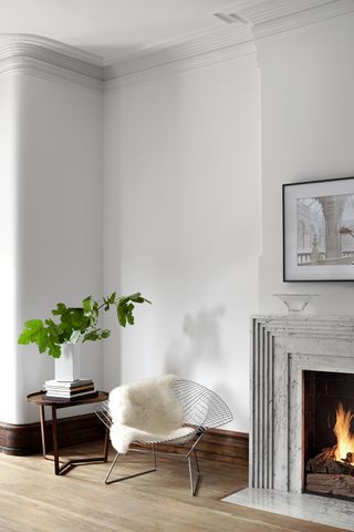 white living room with marble fireplace