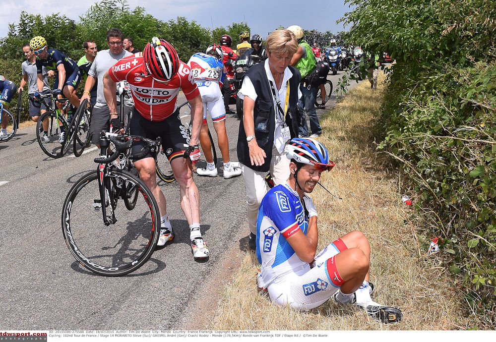 Steve Morabito gets medical attention after crashing during stage 14.