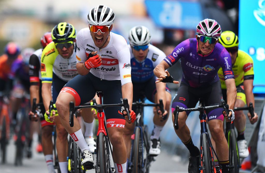 TORREVIEJA SPAIN FEBRUARY 05 Matteo Moschetti of Italy and Team Trek Segafredo celebrates winning ahead of Manuel Penalver Aniorte of Spain and Team Burgos BH and Alexander Kristoff of Norway and Team Intermarch Wanty Gobert Matriaux during the 73rd Volta A La Comunitat Valenciana 2022 Stage 4 a 1931km stage from Orihuela to Torrevieja VCV2022 on February 05 2022 in Torrevieja Spain Photo by Dario BelingheriGetty Images