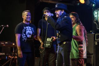 Lemmy picks up a lifetime achievement award at Bass Player Live! in Los Angeles from Robert Trujillo (right)