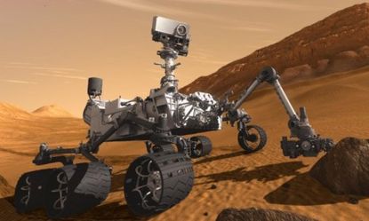 Curiosity, NASA's supped-up Mars rover, pictured in an artist concept, was supposed to launch fall 2011, but it's getting a red light from the inspector general.