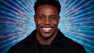 Gladiators star Harry Aikines-Aryeetey, aka Nitro, smiling for the camera against a sparkly background