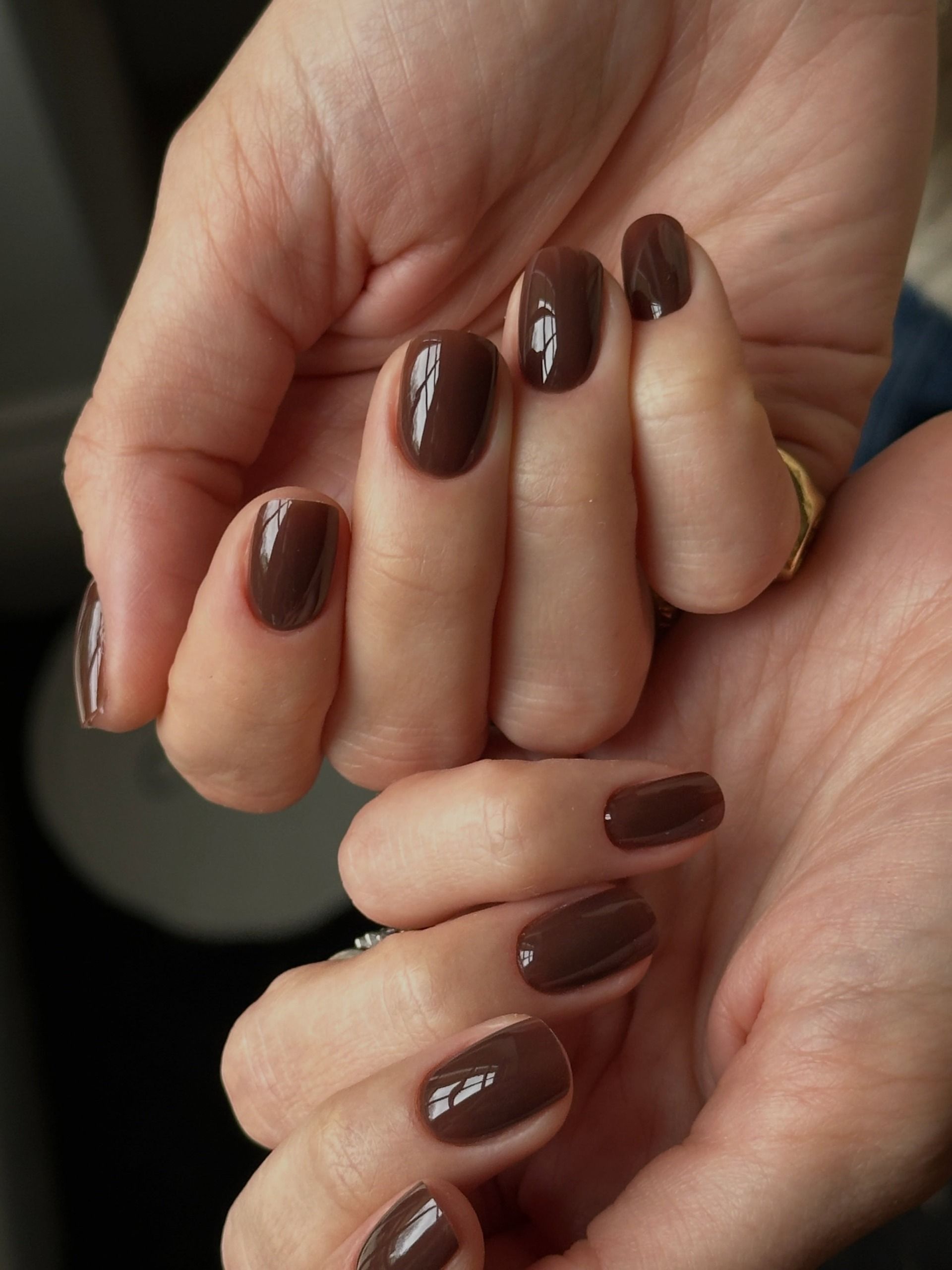 short oval nails in a deep glossy chocolate brown, super simple but pretty