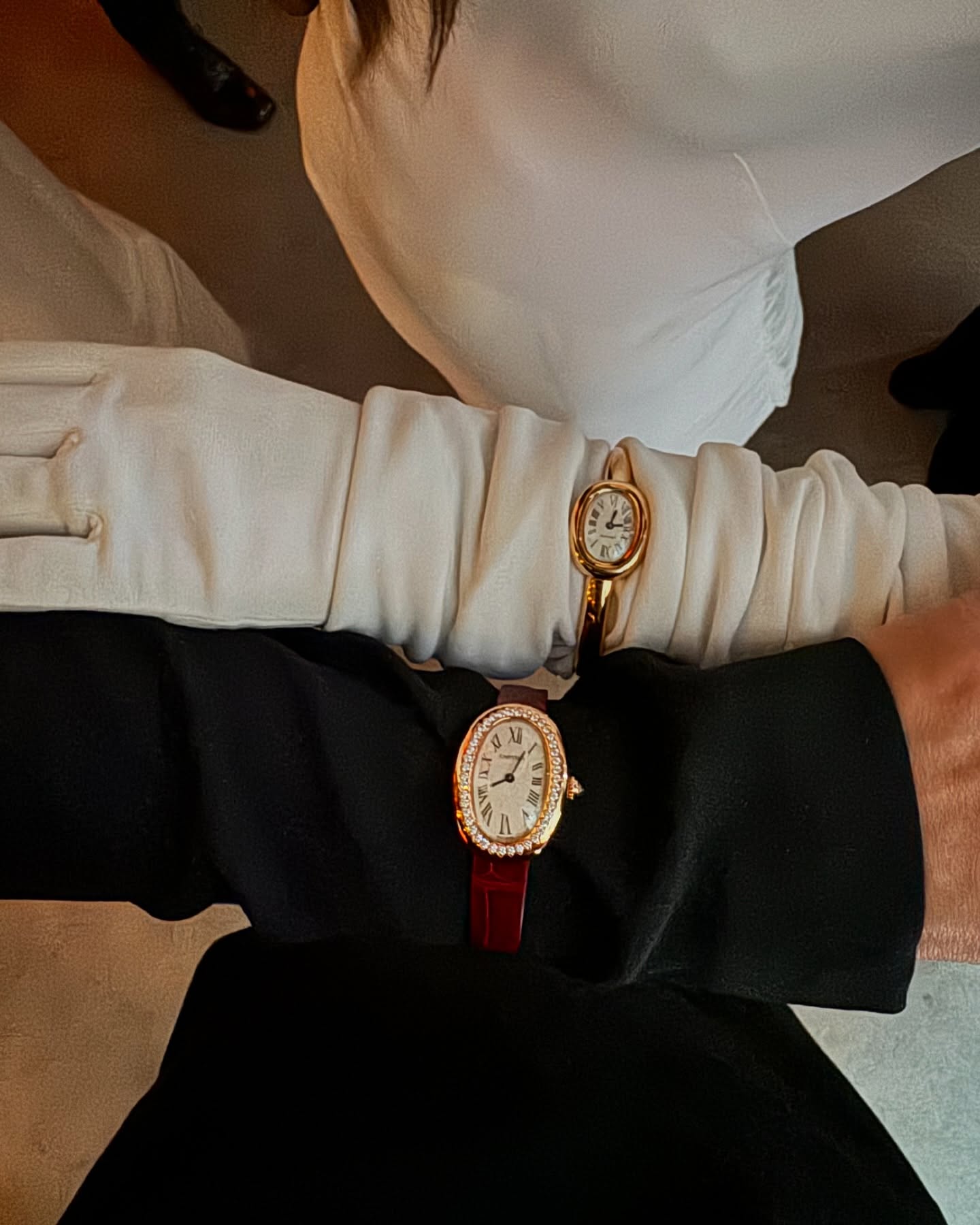 @annelauremais and a friend wear Cartier Baignoire watches