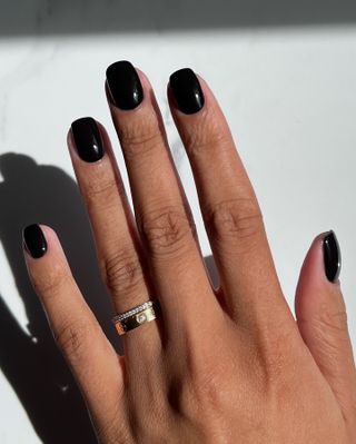 Shiny black nails by celebrity nail artist Iram Shelton.