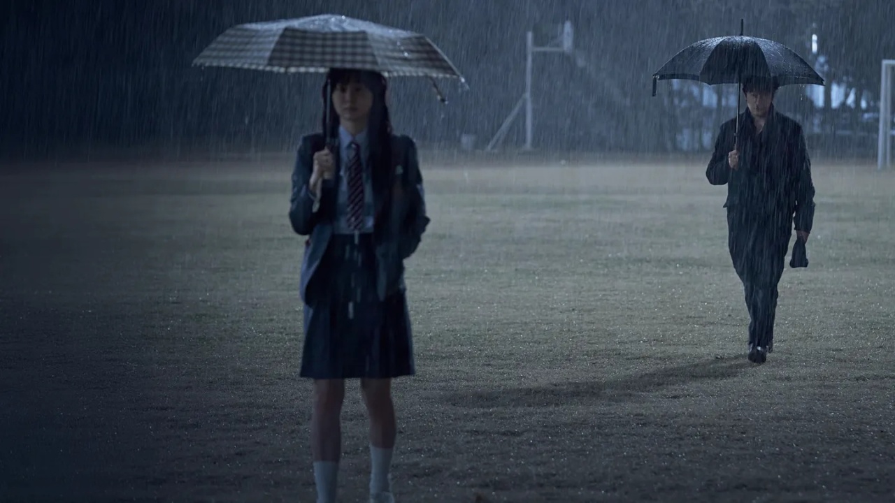 Characters standing in the rain in Nine Puzzles
