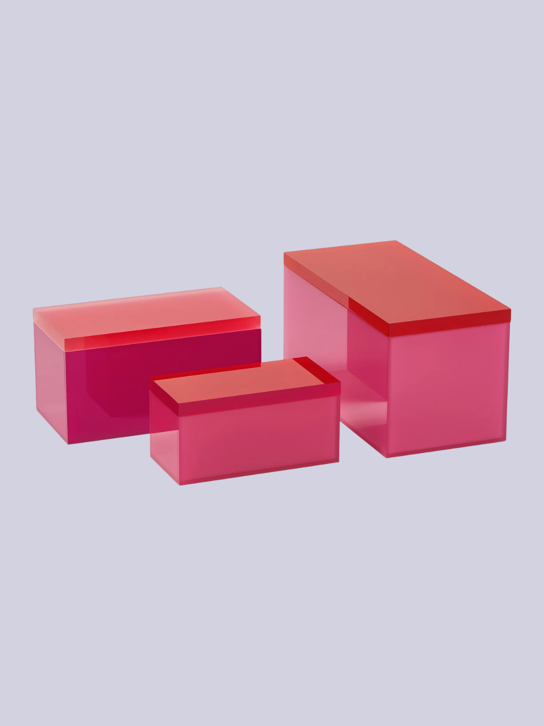 A set of three pink and red storage boxes