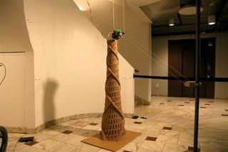 The Hangprinter assembing a sculpture of the Tower of Babel.