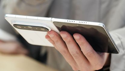The Huawei Pura X Max being held in the hand