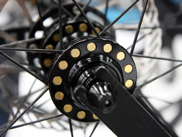 Cole's spoked wheels use freely rotating aluminum barrels to seat the spoke heads in the hub flange, saying they allow for more precise spoke alignment and higher tensions.