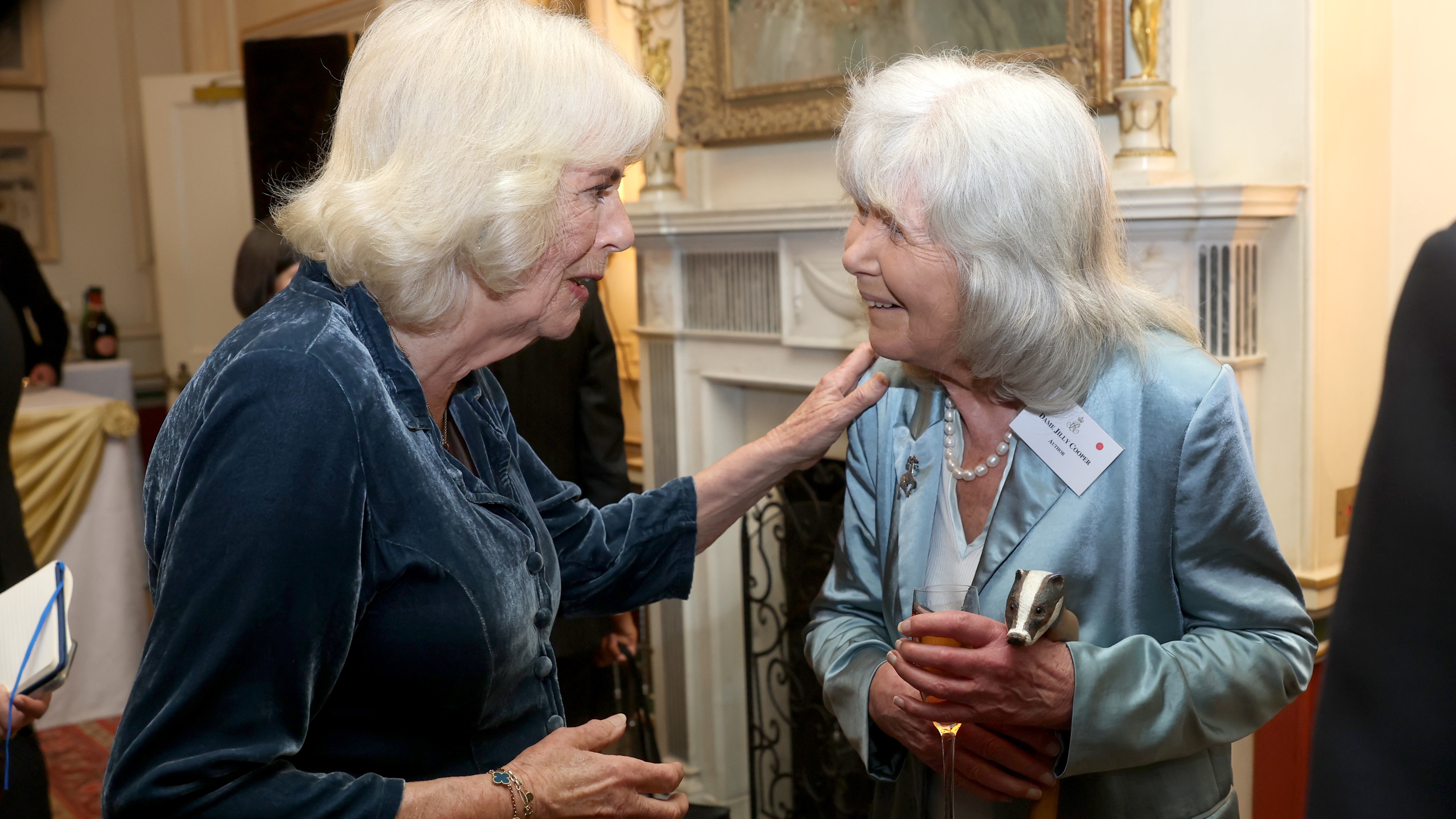 Queen Camilla and Jilly Cooper pose during a reception to mark the launch of the Queen&#039;s reading room medal at Clarence House on March 25, 2025 in London, England. Queen Camilla, accompanied by King Charles III, The Duchess of Gloucester, and distinguished authors along with members of the literary community, came together to celebrate the continued efforts of The Queen&#039;s Reading Room and its mission to inspire greater reading among people. (Photo by Chris Jackson/Getty Images)