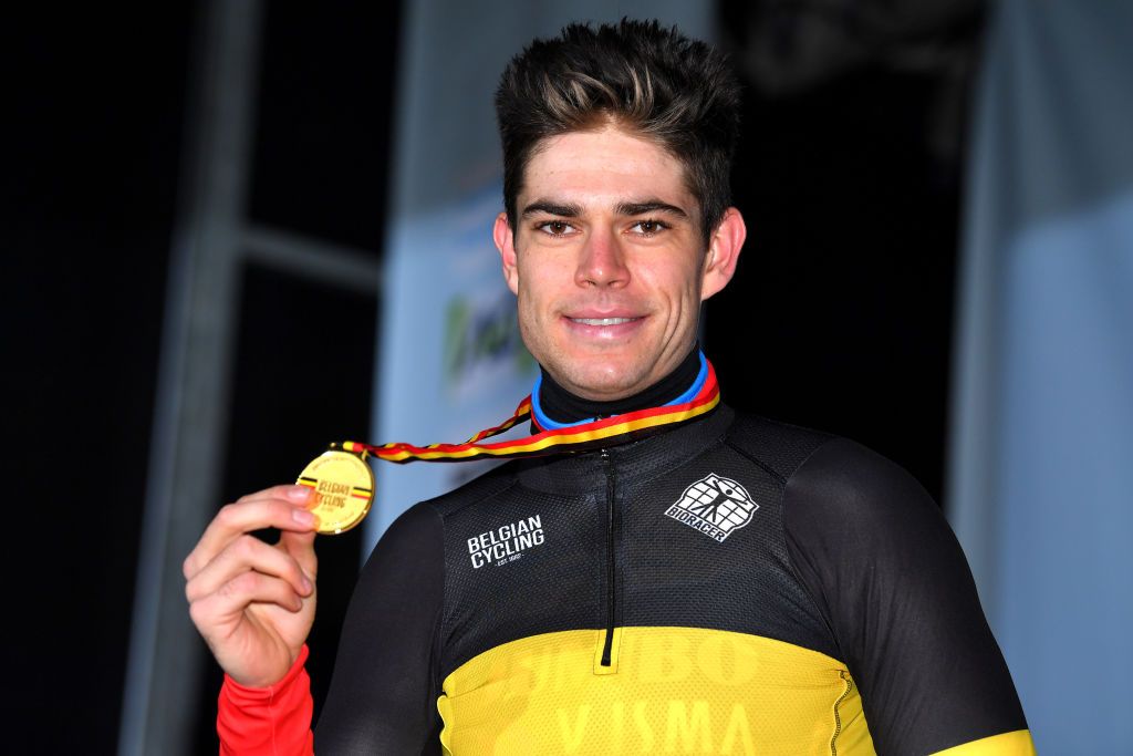 MIDDELKERKE BELGIUM JANUARY 09 Gold medalist Wout Van Aert of of Belgium poses on the podium during the medal ceremony after the 105th Belgian National Cyclocross Championships 2022 Mens Elite bkmiddelkerke on January 09 2022 in Middelkerke Belgium Photo by Luc ClaessenGetty Images