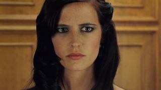 Eva Green wearing a look of concern in an elevator in Casino Royale.