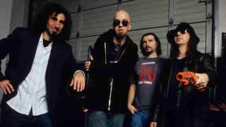 System Of A Down posing for a photograph backstage