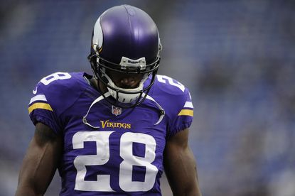 Vikings' Adrian Peterson will play football after all despite child abuse indictment