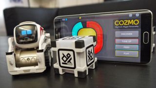 Cozmo with his cube.