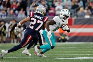 Tyreek Hill #10 of the Miami Dolphins runs against the New England Patriots during the game at Gillette Stadium on January 01, 2023 