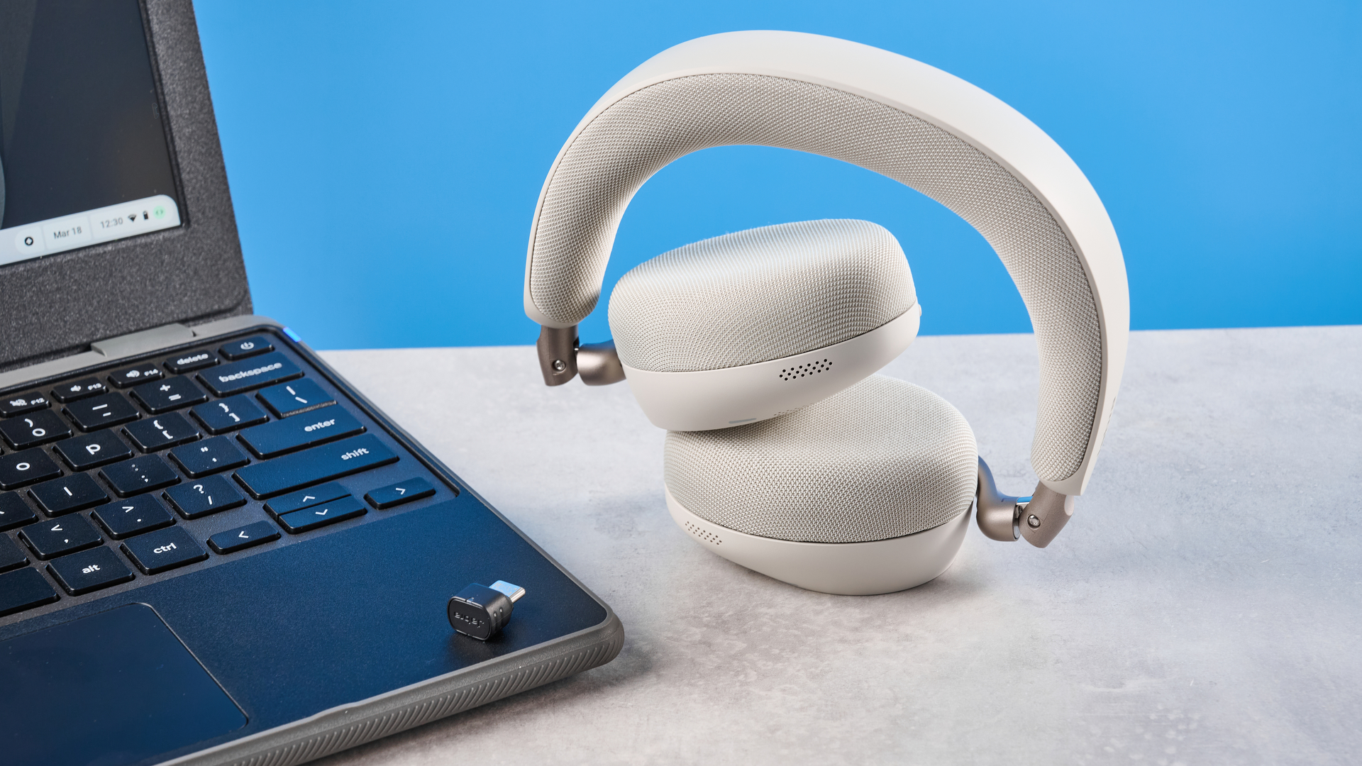 Jabras Evolve3 75 conferencing headset on a stone surface with a blue background