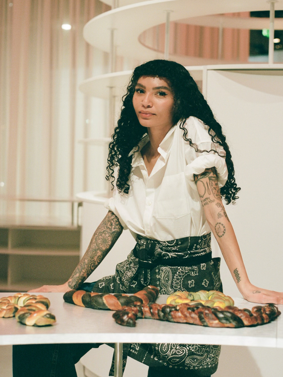 Portrait of chef Sophia Roe wearing white button-down shirt and apron.
