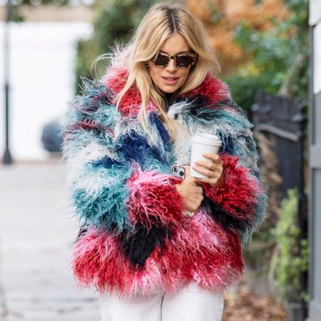 Sienna Miller was spotted in London wearing unseasonal white jeans and ballet flats
